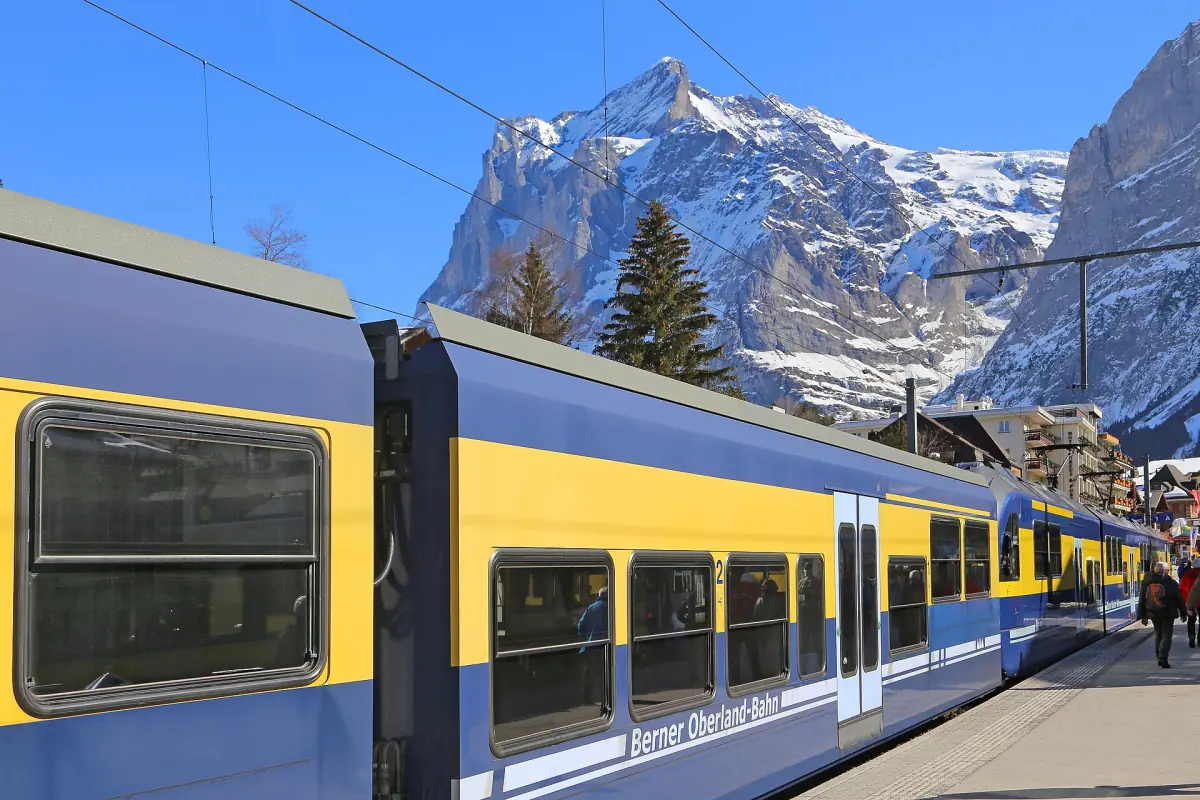 A Berner Oberland-Bahn train at Grindelwald station below the Wetterhorn