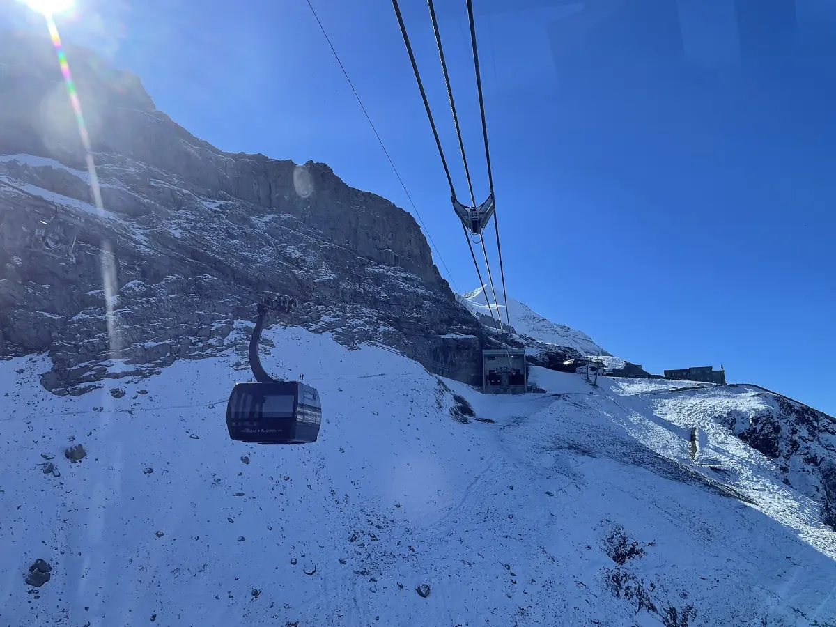 An Eiger Express gondola beside the Eiger