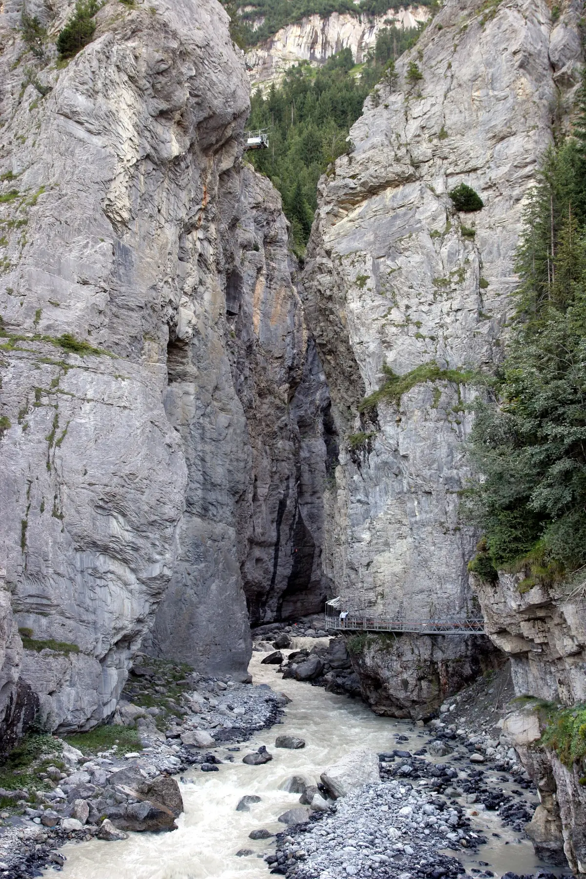 The narrow gorge of the Grindelwald Glacier Canyon with the glacier river below
